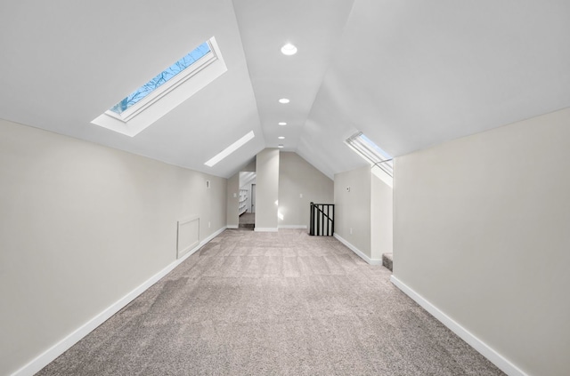 bonus room with lofted ceiling, carpet flooring, recessed lighting, and baseboards