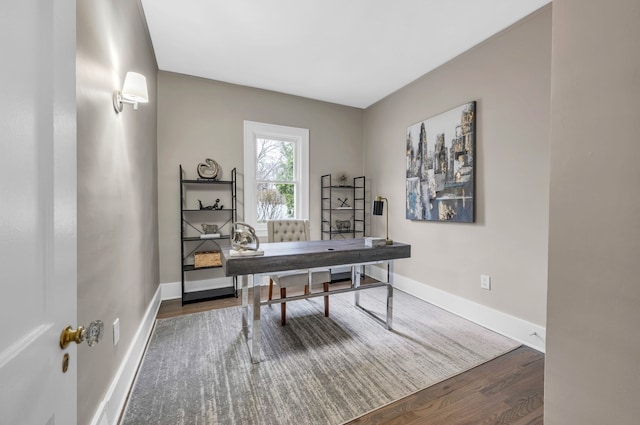 office featuring baseboards and wood finished floors
