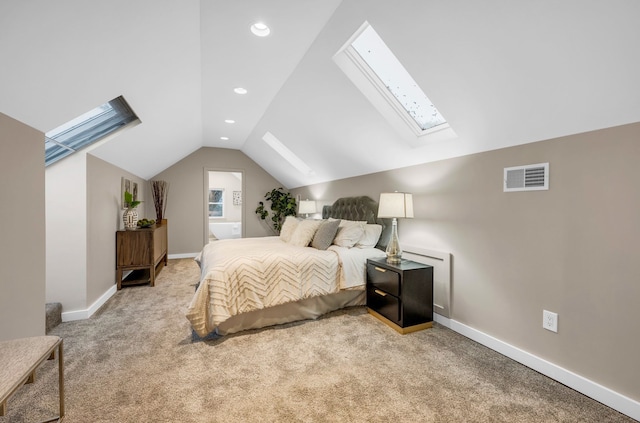bedroom featuring visible vents, baseboards, vaulted ceiling with skylight, recessed lighting, and light carpet