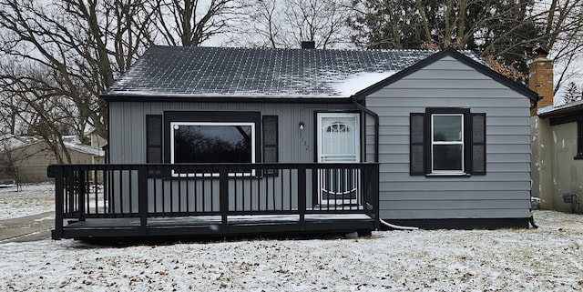 bungalow featuring a chimney