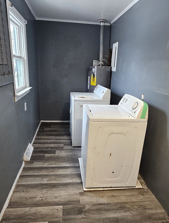 washroom featuring laundry area, ornamental molding, electric water heater, and separate washer and dryer