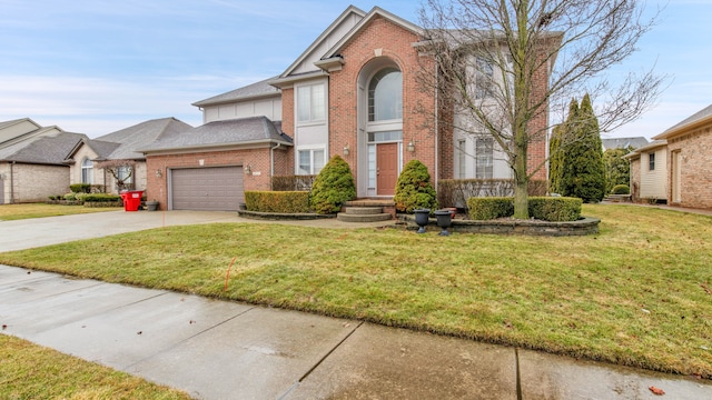 traditional-style house featuring a front lawn, driveway, an attached garage, a shingled roof, and brick siding