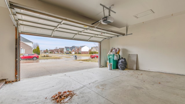 garage featuring a residential view and a garage door opener