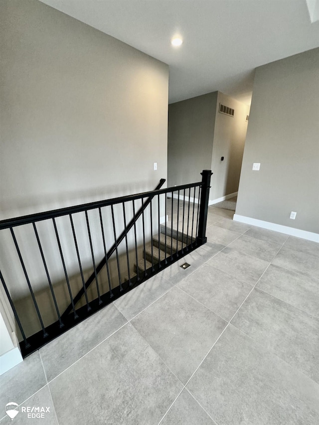 stairs featuring recessed lighting, visible vents, and baseboards