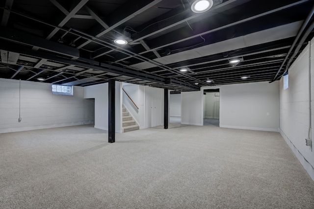 basement featuring stairs