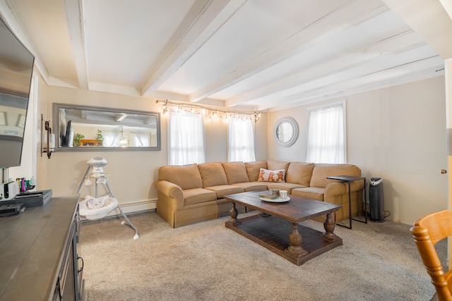 carpeted living area featuring a baseboard heating unit and beam ceiling