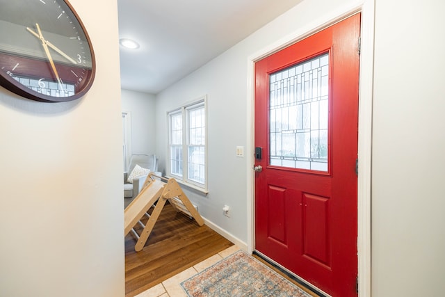 tiled entryway with baseboards