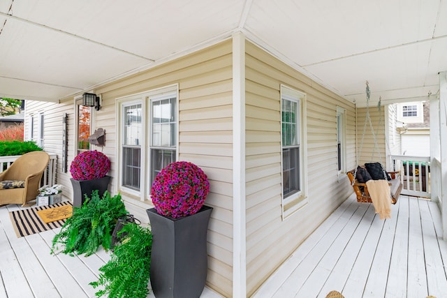 wooden terrace featuring covered porch