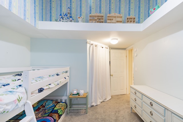 bedroom with light colored carpet