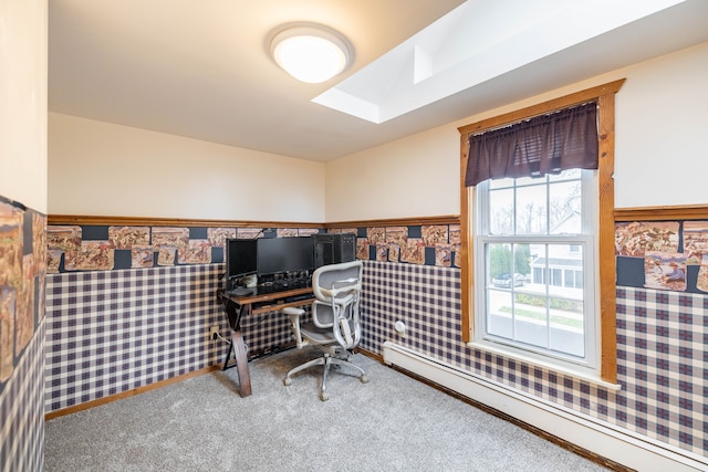 home office featuring a baseboard radiator, a skylight, wainscoting, and wallpapered walls