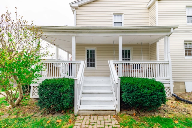 property entrance with covered porch