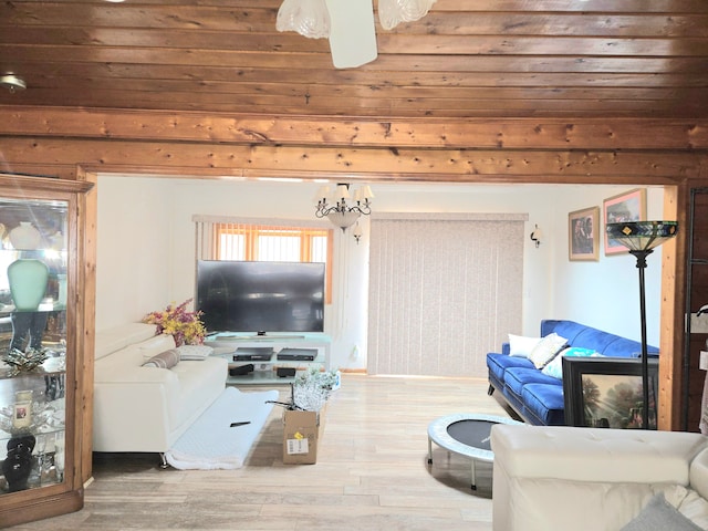 living room with wood finished floors and ceiling fan