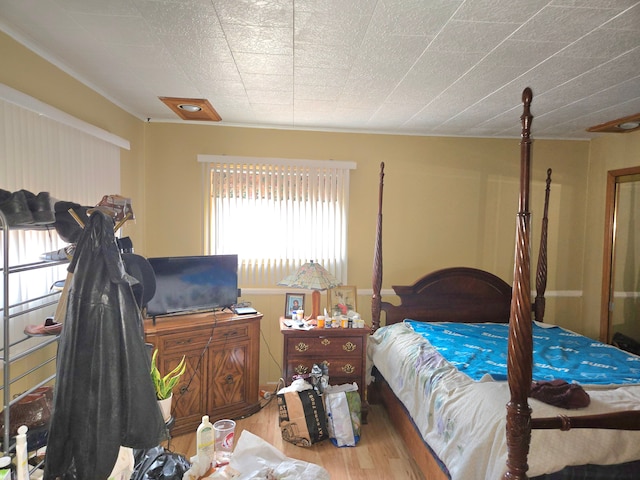 bedroom featuring wood finished floors