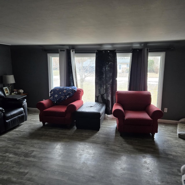 living room featuring baseboards and wood finished floors