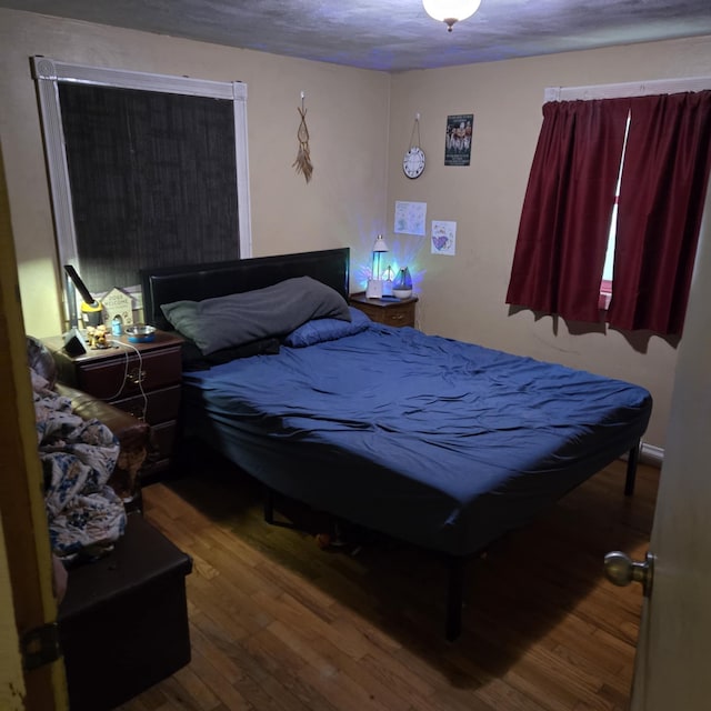 bedroom with wood finished floors