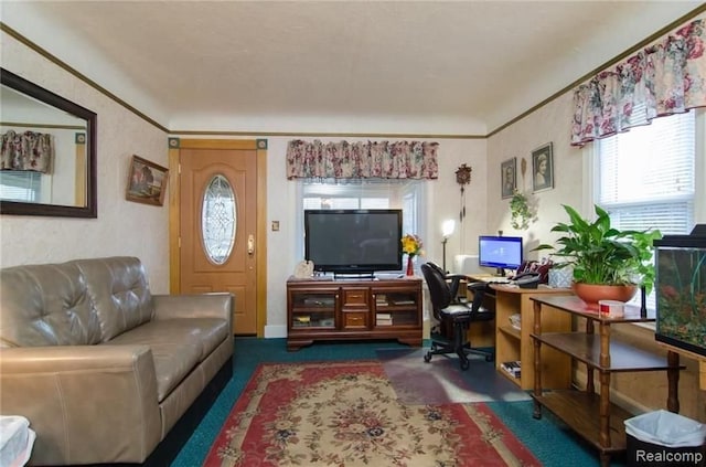 living area featuring carpet floors and ornamental molding