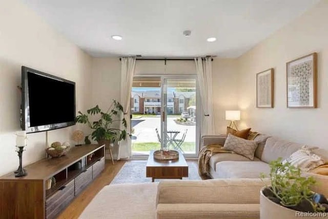 living room featuring recessed lighting and light wood-type flooring