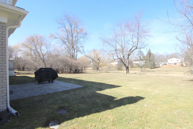 view of yard featuring a patio area and fence