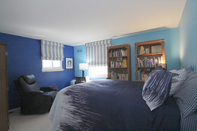 bedroom featuring visible vents and carpet floors