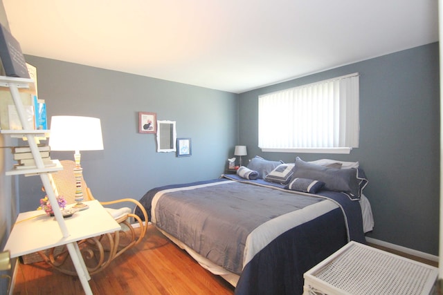 bedroom featuring wood finished floors