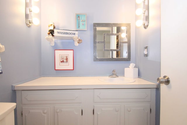 bathroom with toilet and vanity