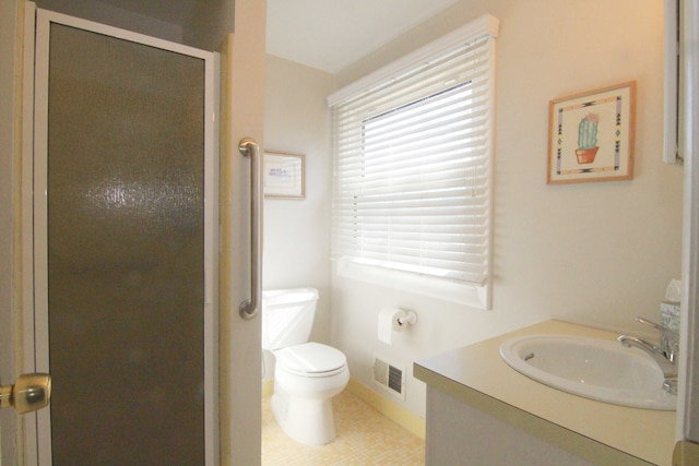 full bathroom with vanity, visible vents, a stall shower, tile patterned flooring, and toilet