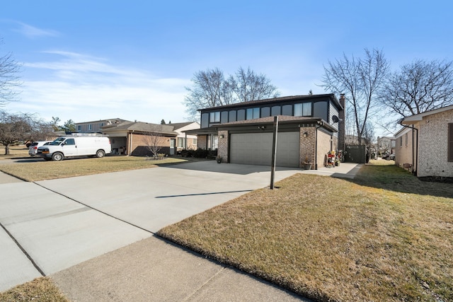 view of yard featuring a garage and driveway