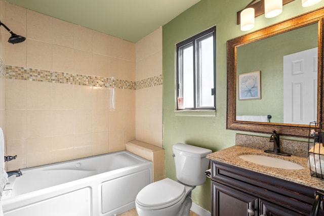 bathroom featuring toilet, vanity, and bathtub / shower combination