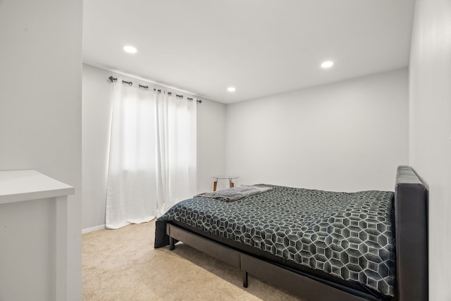 carpeted bedroom featuring recessed lighting and baseboards