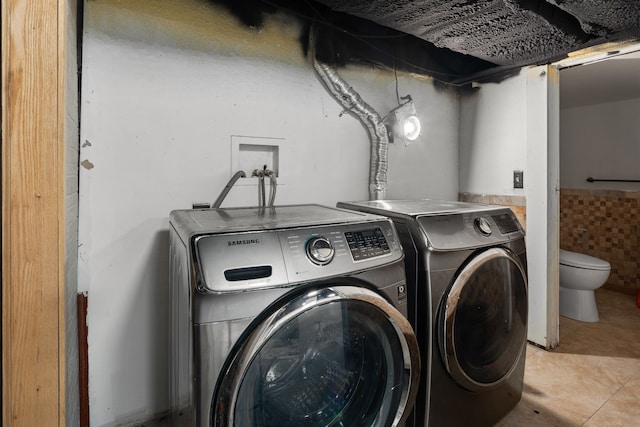 clothes washing area featuring laundry area and independent washer and dryer