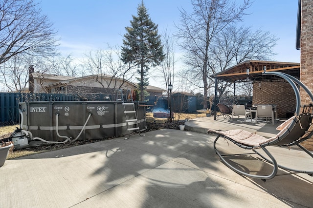 view of patio / terrace featuring a fenced backyard and a fenced in pool