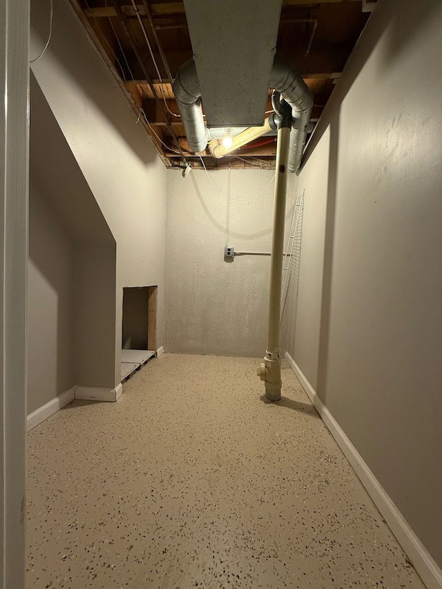 unfinished basement featuring baseboards