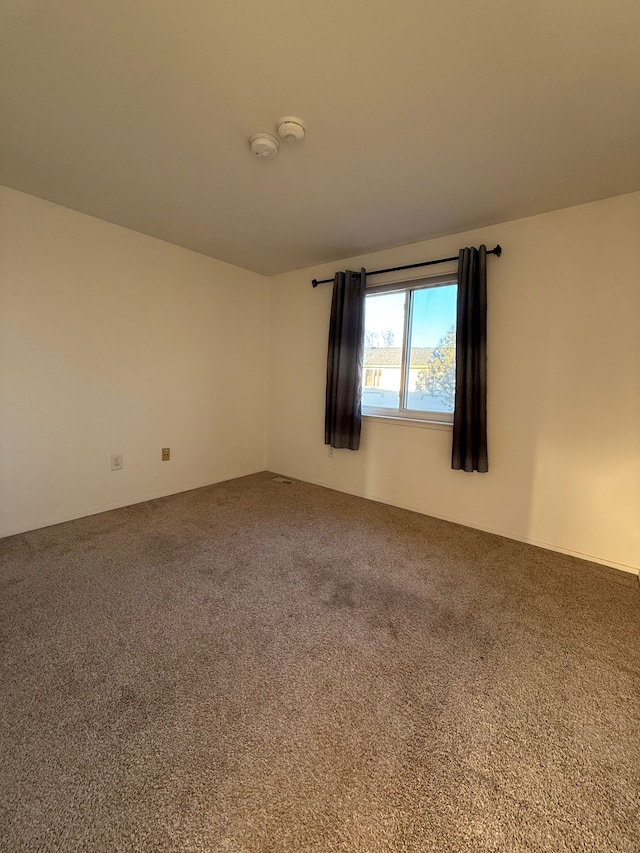 spare room with carpet flooring