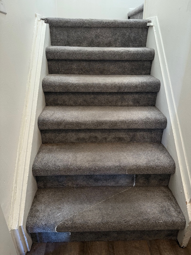 stairs with wood finished floors