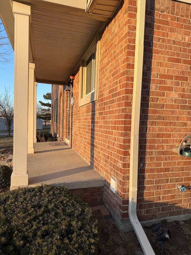 view of home's exterior with brick siding