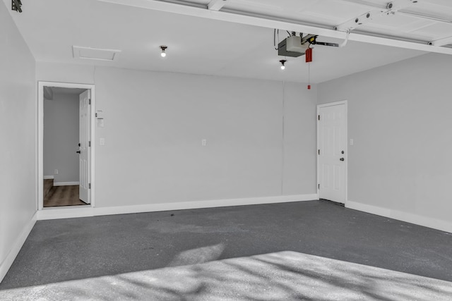 garage featuring baseboards and a garage door opener