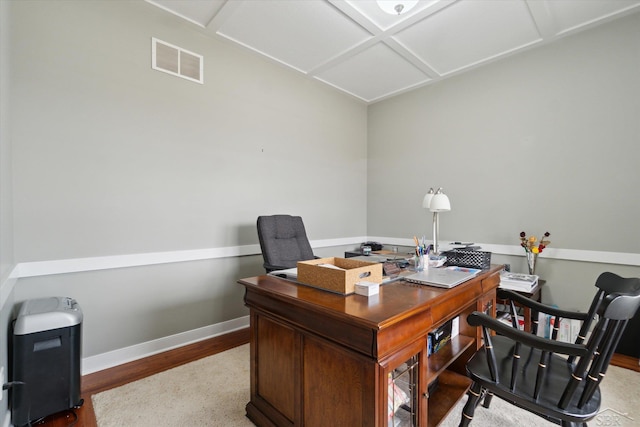 home office featuring wood finished floors, baseboards, and visible vents