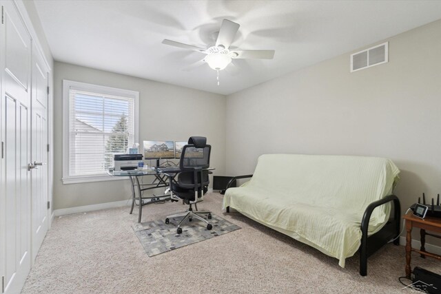 home office featuring visible vents, a ceiling fan, baseboards, and carpet floors