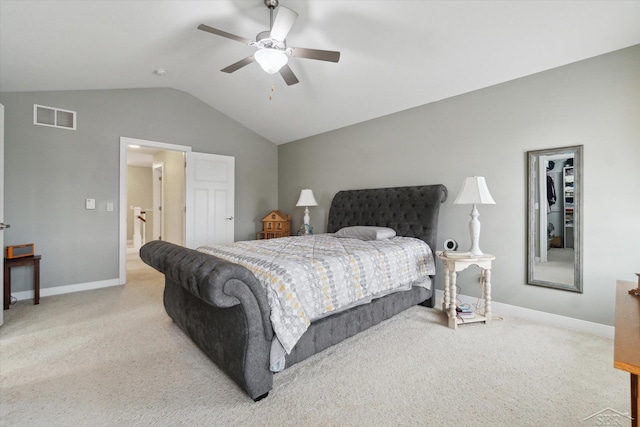 bedroom featuring visible vents, light carpet, baseboards, and vaulted ceiling