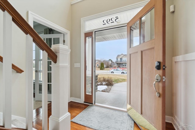 entrance foyer with wood finished floors and baseboards