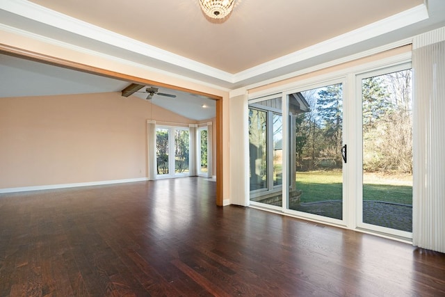 spare room featuring lofted ceiling with beams, wood finished floors, baseboards, and ornamental molding