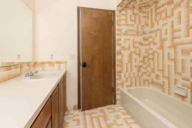 full bathroom featuring a tub, walk in shower, and vanity