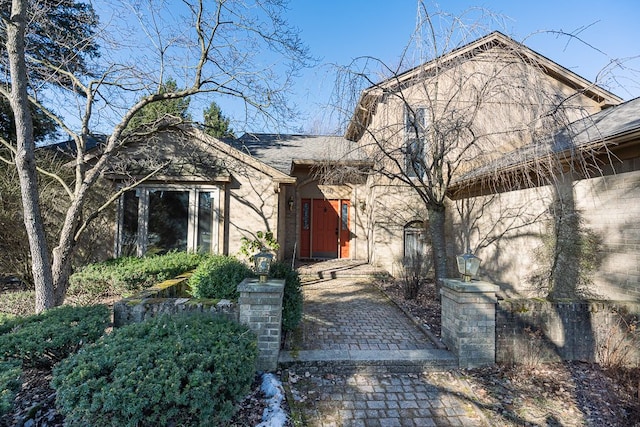 view of front of house with a shingled roof