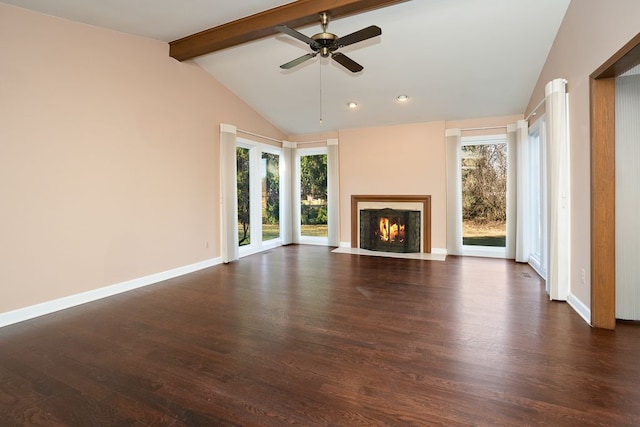 unfurnished living room with a wealth of natural light, a fireplace with flush hearth, lofted ceiling with beams, and dark wood finished floors