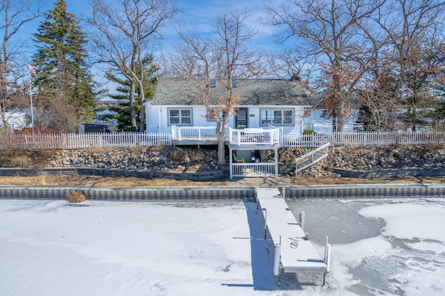 exterior space with a deck and fence