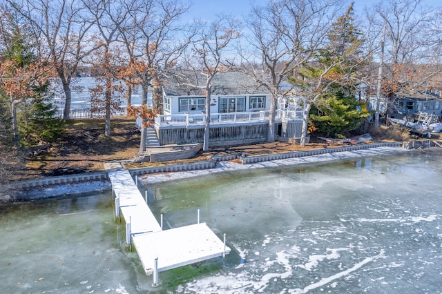 view of dock featuring a deck with water view