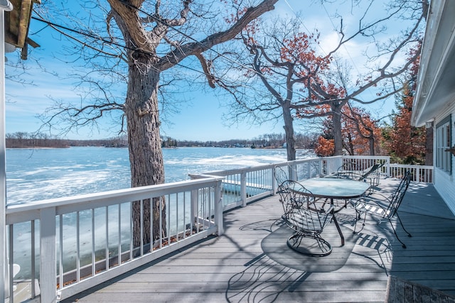 wooden deck featuring a water view