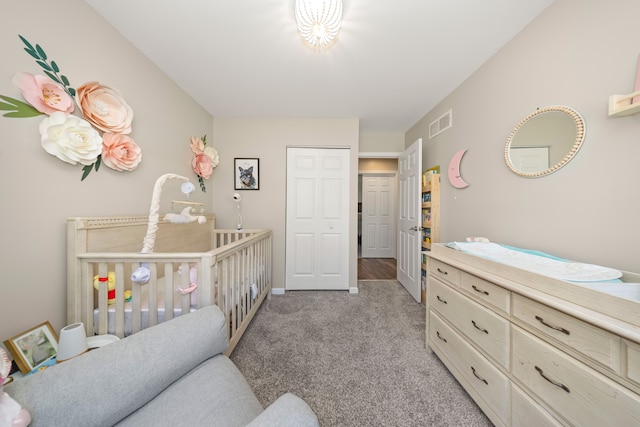 carpeted bedroom featuring visible vents and baseboards