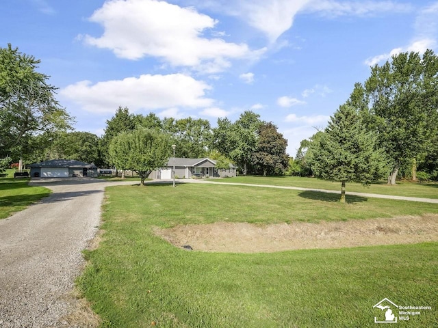 view of property's community featuring a yard