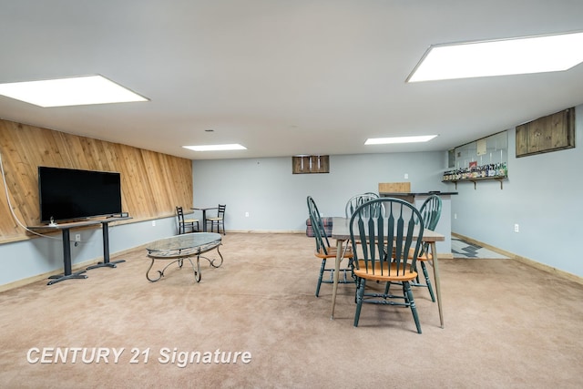 rec room with baseboards and carpet floors